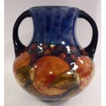 A Moorcroft pottery vase of squat, bulbous form, having a wide,