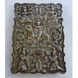 An early 20thC Asian white metal card case of shaped outline, having a hinged cap,