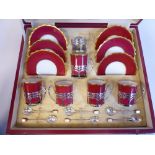 A set of five (of six) Aynsley china, raspberry coloured and gilded coffee cans and six saucers,