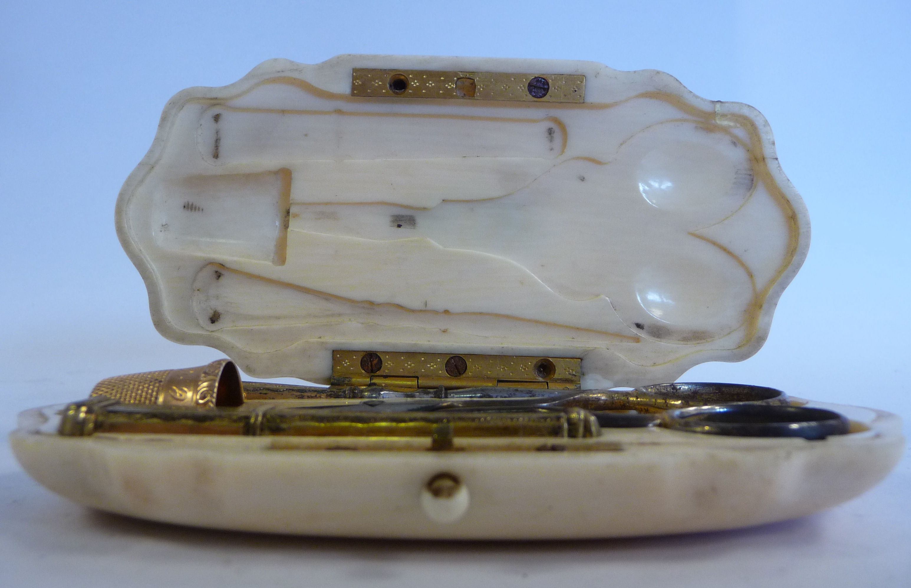 A mid Victorian carved ivory folding needlework case with yellow metal mounts and various - Image 2 of 5