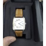 A lady's Raymond Weiss stainless steel cased wristwatch, faced by a Roman dial, on a stitched,