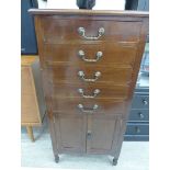 An Edwardian mahogany music cabinet with five drawers, over a pair of panelled doors,