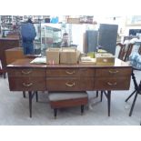 A mid 20thC mahogany finished dressing table, surmounted by a triptych mirror, over six drawers,