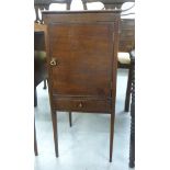 A late 19thC mahogany pot cupboard with a door, over a base drawer, raised on square,