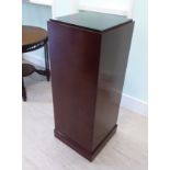 A modern mahogany finished pedestal,