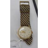 An Angus yellow metal cased manual wind-up wristwatch,