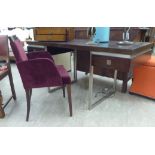 A modern dark stained hardwood veneered desk, fitted with two shallow flank drawers,