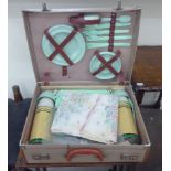 A 'vintage' picnic set, comprising plastic cutlery, plates,