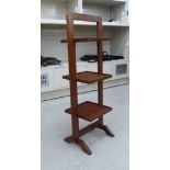 An Art Deco style mahogany three tier folding cakestand,