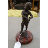 Franz Ifland - a cast and patinated bronze, a standing cherubic figure, on a turned,