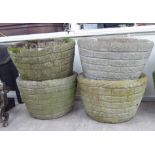 A set of four composition stone planters 11''h 16''dia F