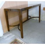 A modern mahogany finished centre table with a mitred top, raised on square, tapered legs,