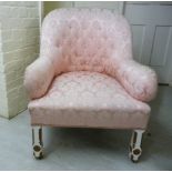 A late Victorian enclosed spoonback armchair, upholstered in part button,