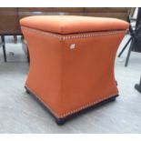 A Regency design box ottoman stool of waisted square form with a hinged top, on button feet,