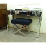 A modern bevelled, mirror panelled, inverted breakfront dressing table with two frieze drawers,