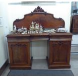 An early Victorian mahogany inverted breakfront sideboard,