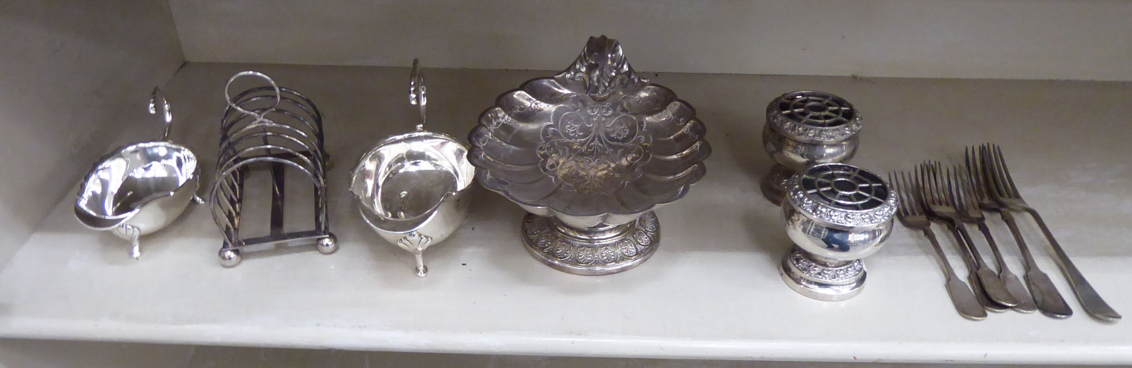 Silver plated tableware: to include a pair of sauce boats with a C-scroll handle,