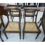 A set of four early Victorian mahogany framed dining chairs with curved bar crests,