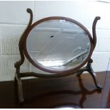 A 1920s Georgian style oval, bevelled toilet mirror,