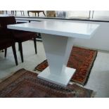 A modern white laminated table,