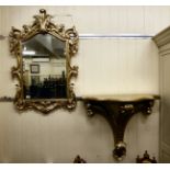 A modern gilt painted serpentine front console table 31''h 33''w; and a matching bevelled mirror,
