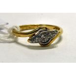 An 18ct gold and platinum crossover ring,