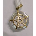 A 9ct gold claw set pentagram pendant 11