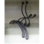 A pair of modern French inspired cast iron valet hooks CA