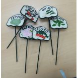 A set of six cast iron vegetable patch markers TO8