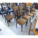 An Edwardian seven piece carved mahogany framed salon suite, comprising an open arm settee,