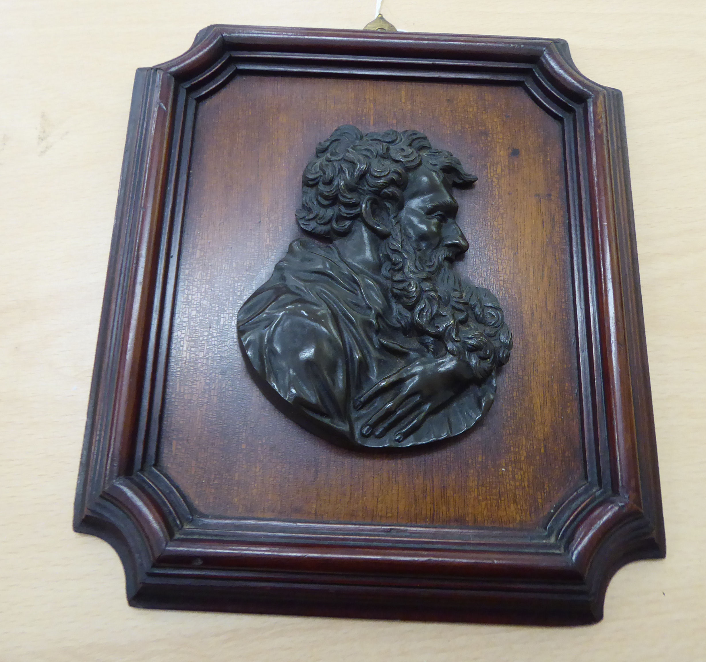 A 19thC cast and patinated bronze plaque, the profile portrait of a bearded man,