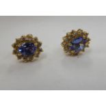 A pair of 14ct gold claw set tanzanite and diamond set earrings 11