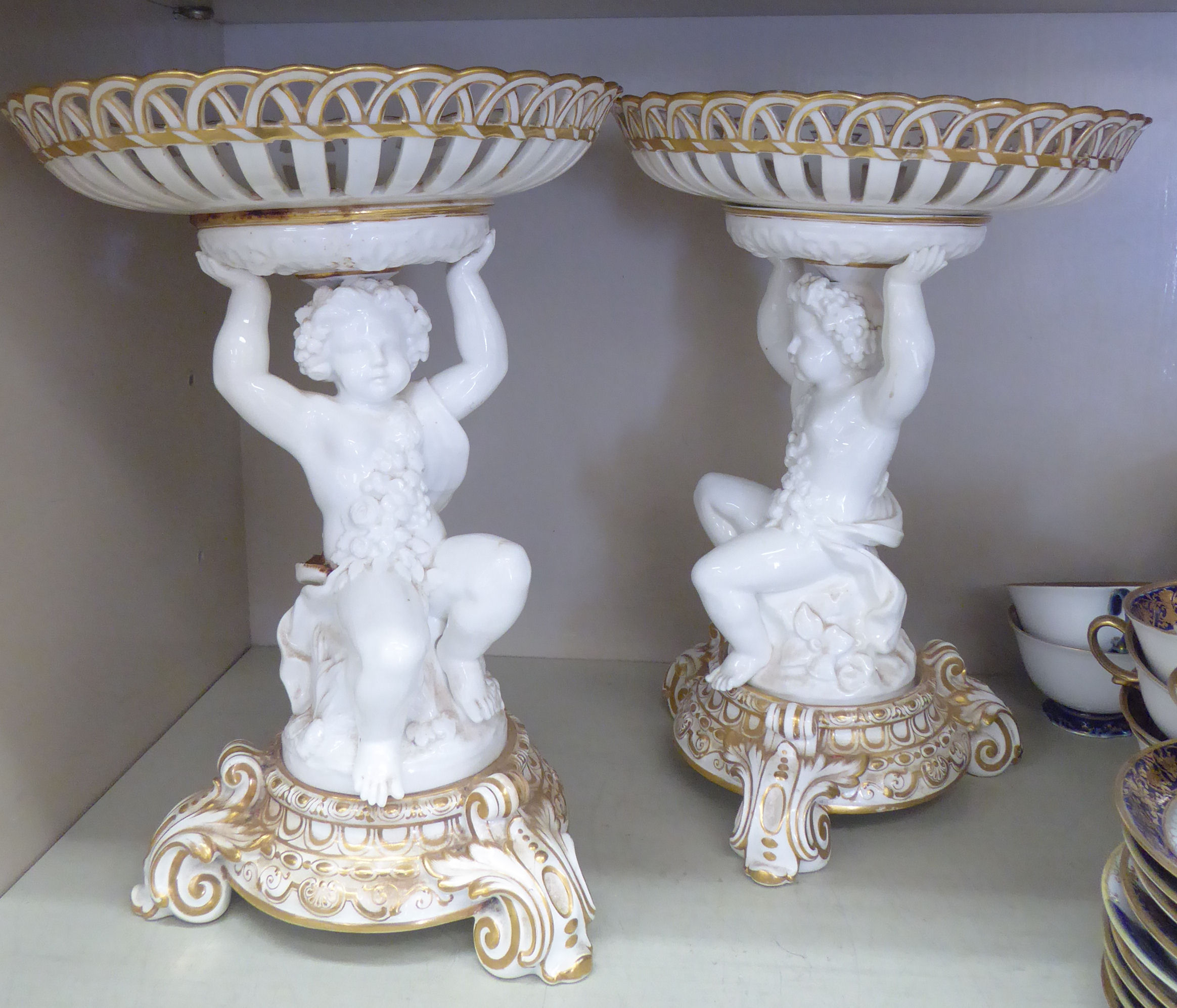 A pair of late 19thC Continental moulded and gilded porcelain centrepiece bowls,