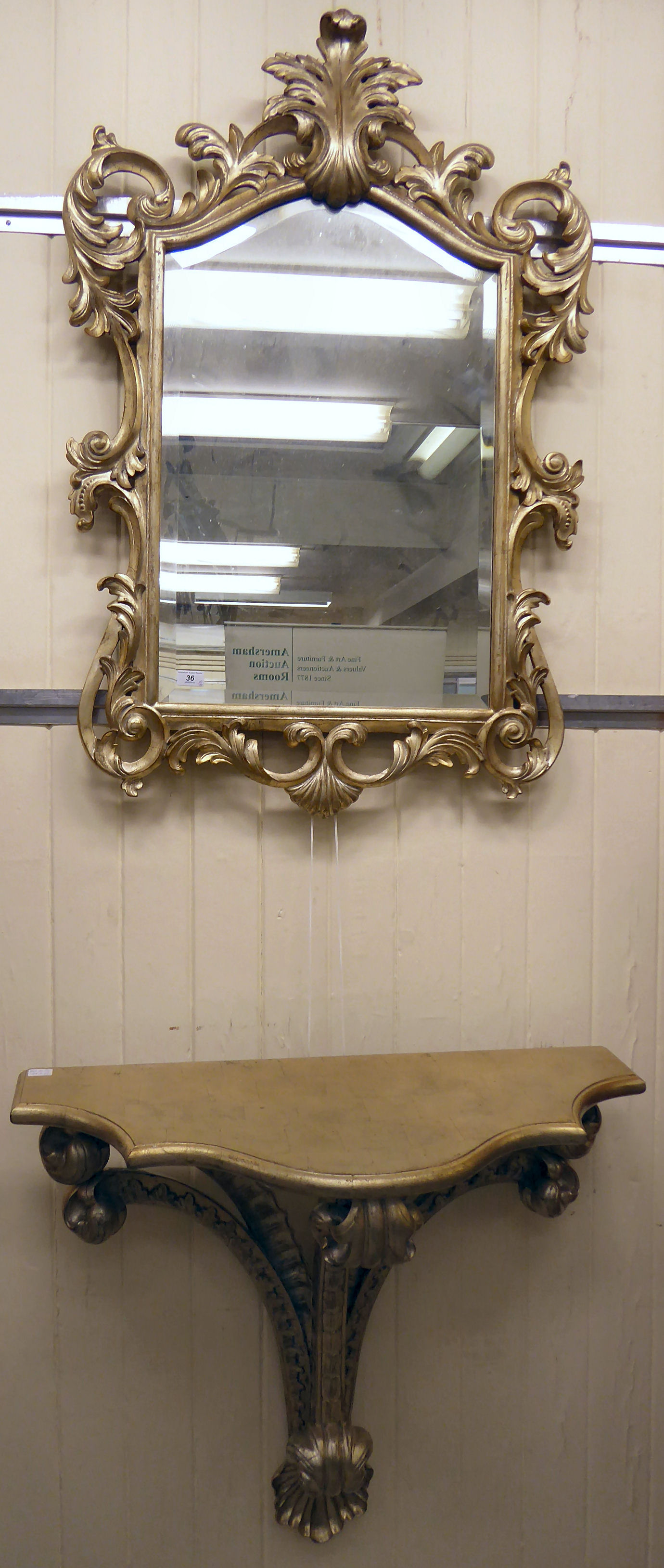 A modern gilt painted serpentine front console table 31''h 33''w; and a matching bevelled mirror,