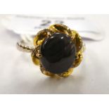 An 18ct gold star sapphire and diamond set ring 11