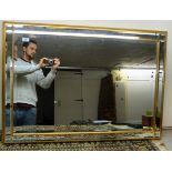 A modern bevelled mirror with slip borders,