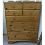 A modern Ducal honey coloured, pine dressing chest,