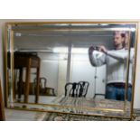 A modern bevelled mirror with slip borders,