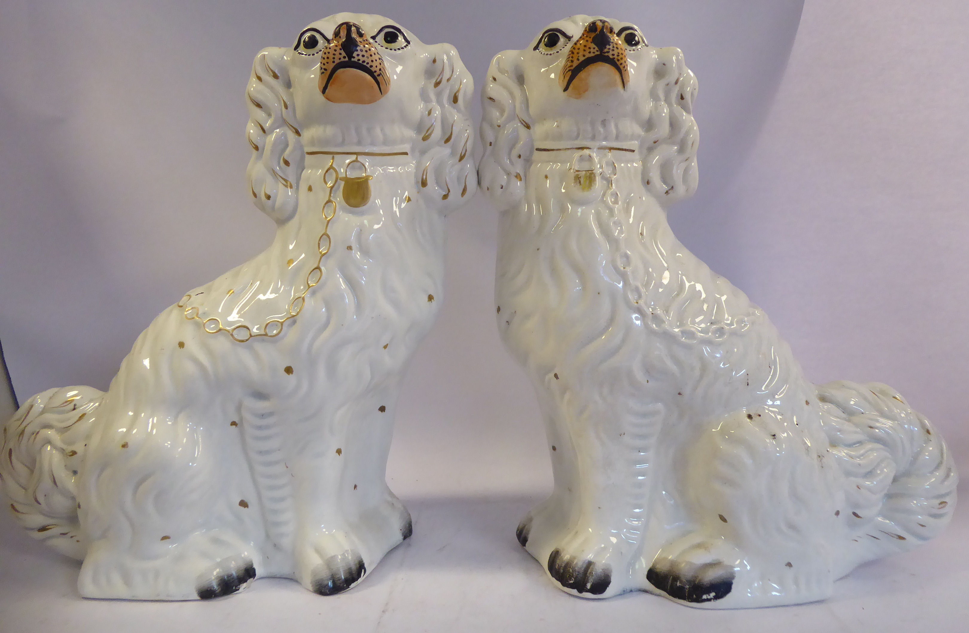 A pair of Staffordshire pottery ivory glazed, seated King Charles Spaniels with painted features, - Image 2 of 6