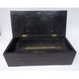 A late 19thC Swiss made black lacquered and walnut veneered music box,
