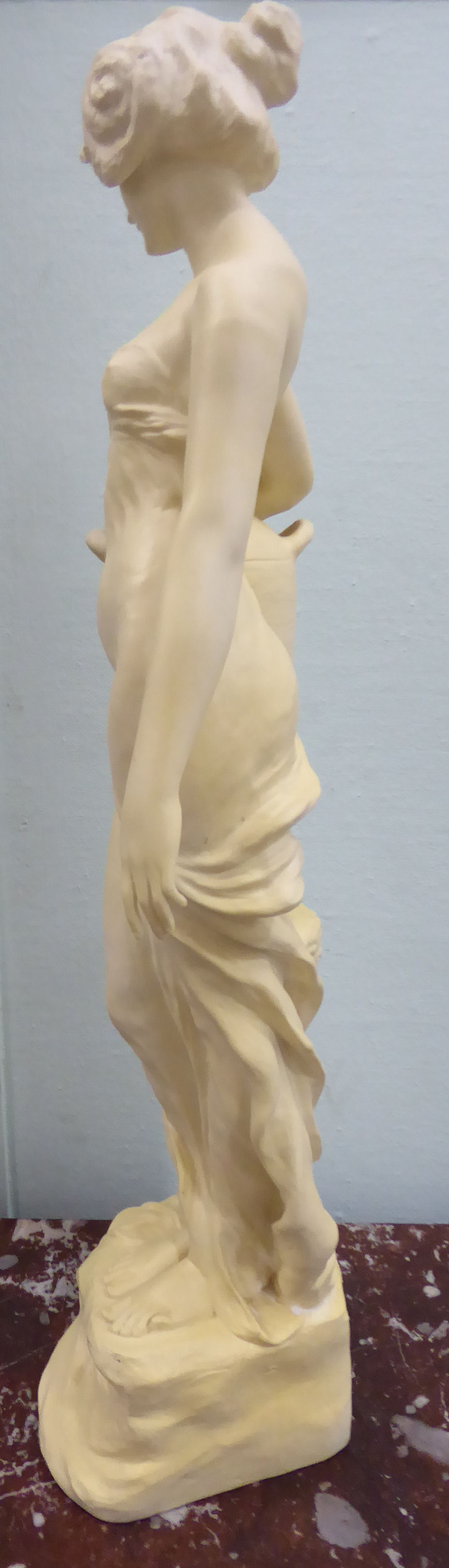 An unglazed standing plaster figure 'Aphrodite' holding a water vessel, - Image 6 of 16