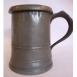 A Georgian quart size pewter tankard with banded decoration,