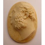 A mid 19thC high relief carved ivory oval profile portrait miniature,