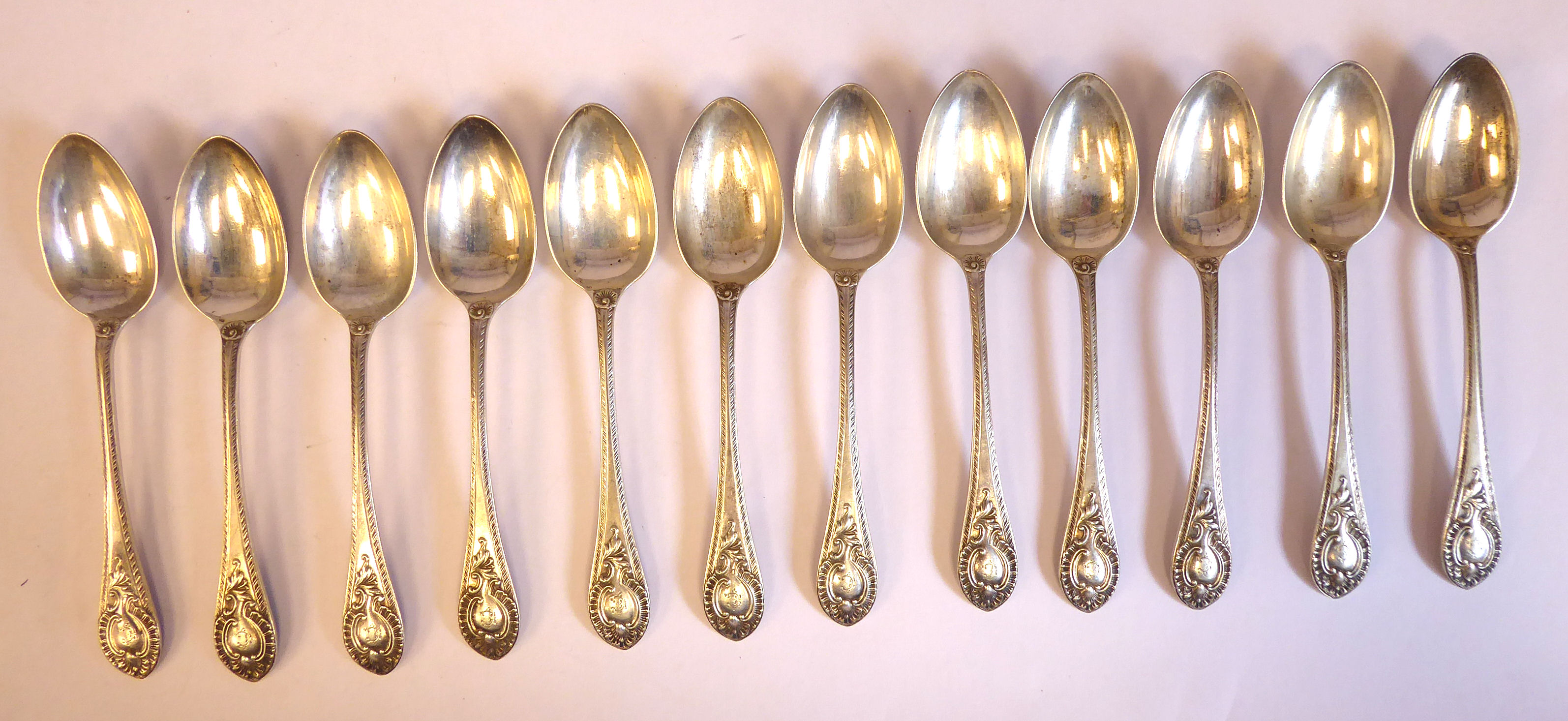 A set of twelve late Victorian silver fruit spoons, cast with shells, foliage, - Image 2 of 12