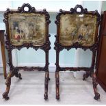 A pair of early Victorian floral and scroll carved rosewood framed freestanding screens,