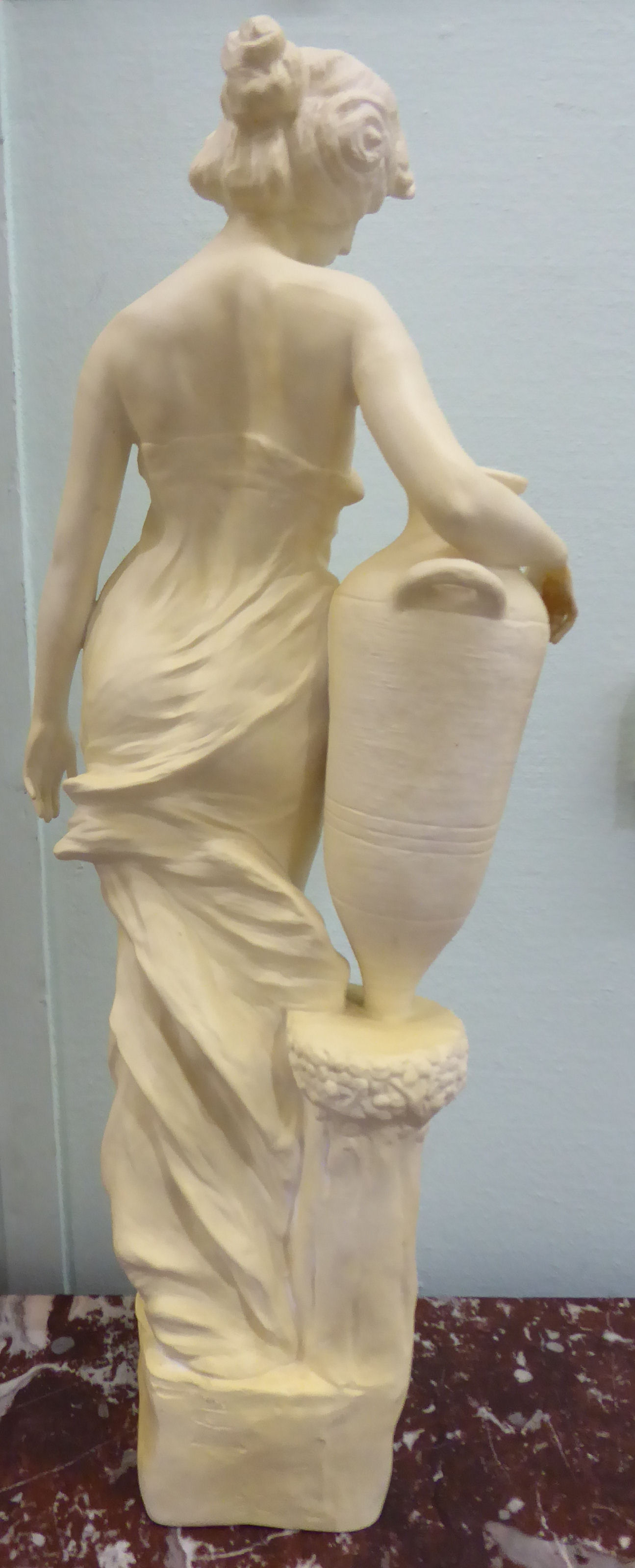 An unglazed standing plaster figure 'Aphrodite' holding a water vessel, - Image 8 of 16