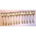 A set of twelve late Victorian silver fruit spoons, cast with shells, foliage,