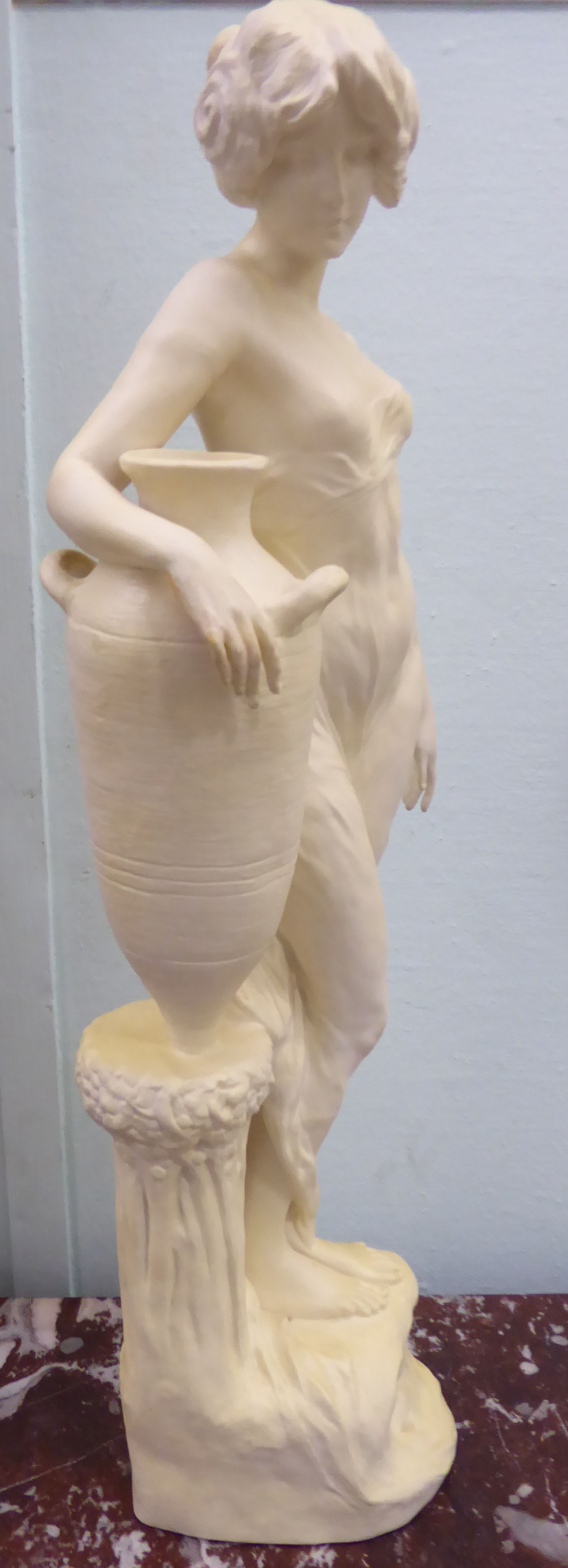 An unglazed standing plaster figure 'Aphrodite' holding a water vessel, - Image 4 of 16
