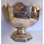 An Edwardian silver rose bowl of octagonal form with a wavy, applied wire rim,