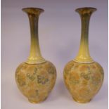 A pair of Royal Doulton misted green and yellow glazed stoneware bulbous bottle vases, having long,